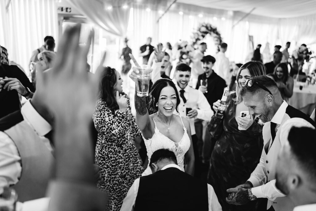 Wedding guests celebrating at the reception